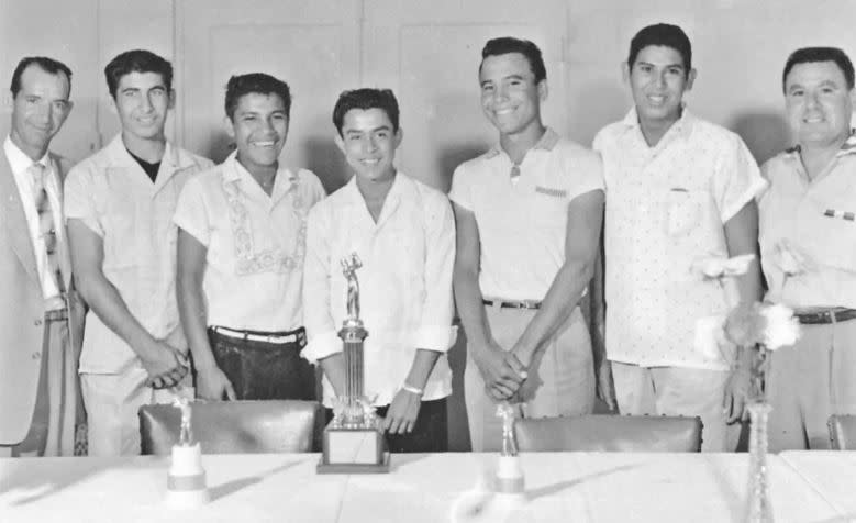 <em>(From Left to right) Coach J.B. Peña, Joe Treviño, Mario Lomas Sr., Gene Vasquez, Felipe Romero, Lupe Felan, Unnamed man in photo</em>