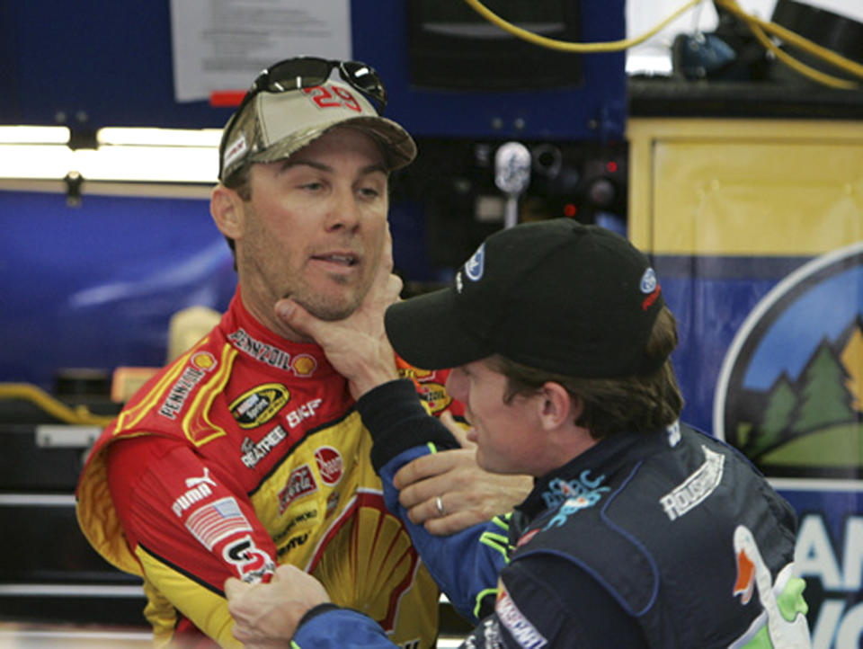 FILE - Drivers Kevin Harvick, left, and Carl Edwards, right, scuffle in the Nationwide series garage area during practice for the NASCAR Nationwide Series General Dollar 300 auto race at Lowe's Motor Speedway in Concord, N.C., Thursday, Oct. 9, 2008. Kevin Harvick said Thursday, Jan. 12, 2023, he will retire from NASCAR competition at the end of the 2023 season. (AP Photo/File)