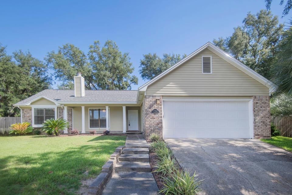 2732 Summertree Ln is in a quiet, charming waterfront neighborhood in Gulf Breeze.