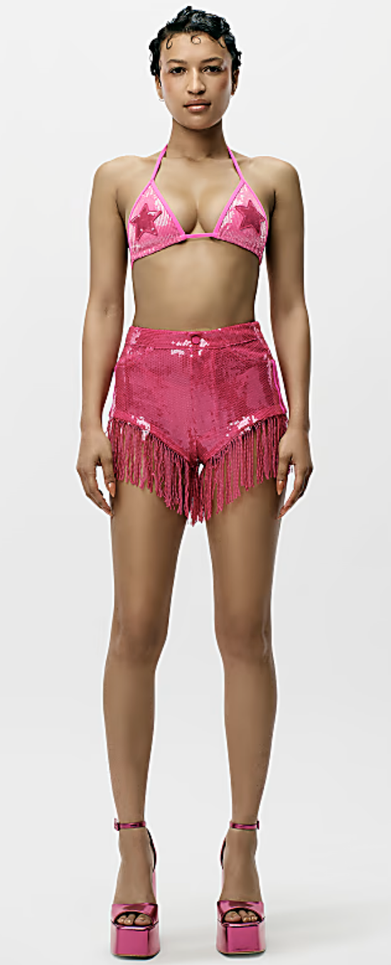 model wearing sparkly pink fringe shorts with pink bikini top