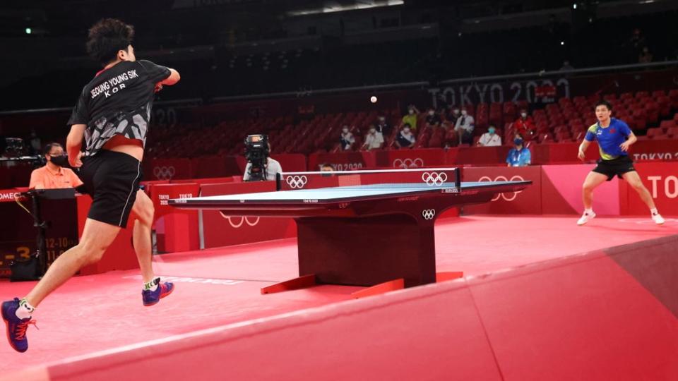 Jeoung Young-Sik of South Korea (left) in action against Fan Zhendong of China (right) at the Tokyo 2020 Olympics (REUTERS)