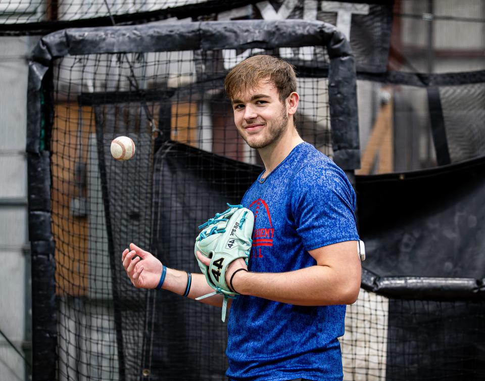 Christian Academy senior Nathan King paused for a photo during a recent batting practice session. On his left arm is a glucose-monitoring system which connects to a phone app that receives real-time data.