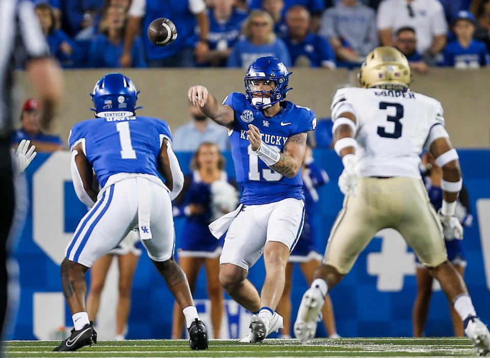 UK quarterback Devin Leary completes his first pass of Saturday's game against Akron to running back Ray Davis.