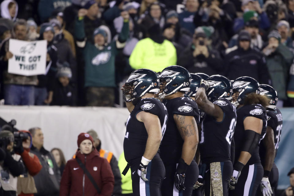 Eagles players line up for a salute after scoring against the Dallas Cowboys. (AP)