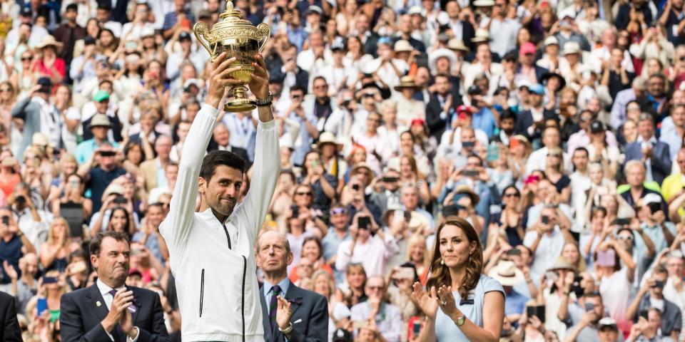 Kate Middleton watches on after presenting Novak Djokovic with the trophy after he won Wimbledon in 2019.