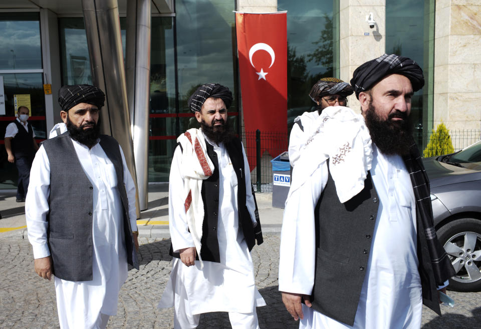 The Taliban delegation led by Amir Khan Muttaqi, the acting foreign minister, not pictured, walk at Esenboga Airport, in Ankara, Turkey, Thursday, Oct. 14, 2021. A high-level delegation of Afghanistan's new Taliban rulers has arrived in Turkey for talks with Turkish officials, the Foreign Ministry announced Thursday. The meetings in the capital of Ankara would be first between the Taliban and senior Turkish government officials after the group seized control of Afghanistan. (AP Photo/Burhan Ozbilici)