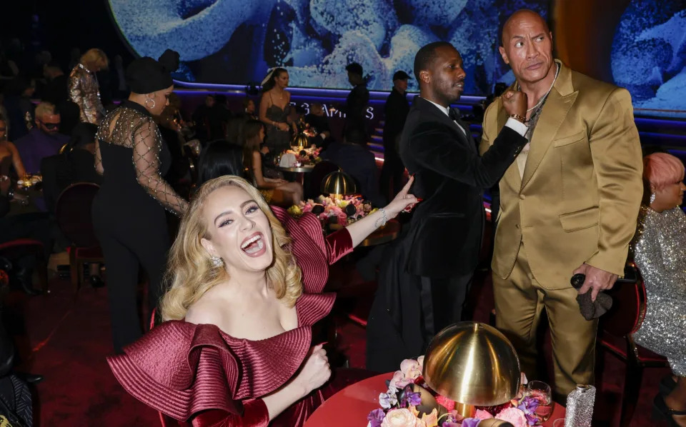 Adele, Rich Paul and Dwayne Johnson at the Grammy Awards this year