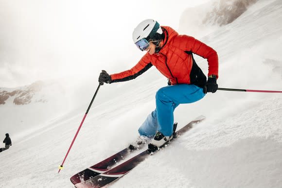 A person skiing with an Apple Watch on their wrist.