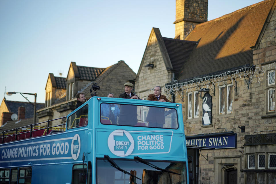 BOLSOVER, ENGLAND - DECEMBER 03: Brexit Party leader Nigel Farage (C) campaigns on the party battle  bus in Bolsover during election campaigning on December 03, 2019 in Bolsover, England.  Political parties continue to campaign around the country as Britain prepares to go to the polls on December 12, 2019 to vote in a pre-Christmas general election. (Photo by Christopher Furlong/Getty Images)