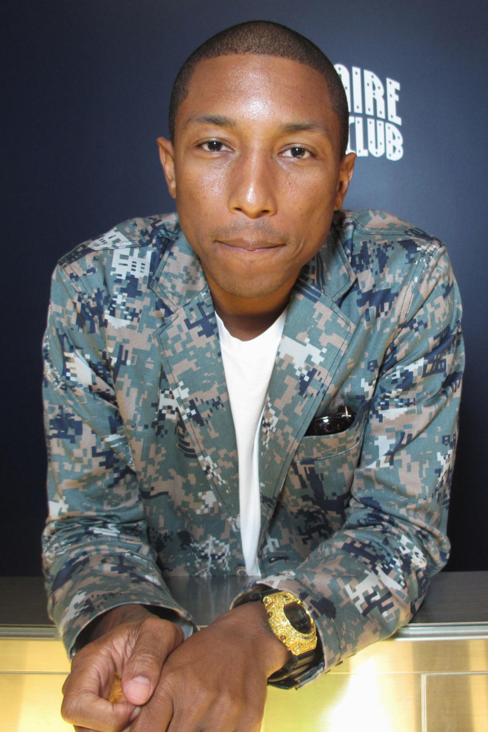 Well, hello Pharrell in your camo jacket, are you as bored as you look?