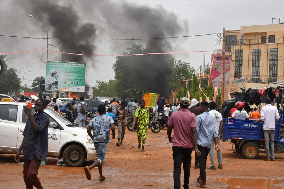 Smoke billows as supporters of  Niger's security forces attack the headquarters of the Nigerien Party for Democracy and Socialism, the party of overthrown President Mohamed Bazoum, in Niamey on July 27, 2023.  (AFP - Getty Images)