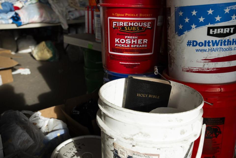 A bible sits among other items donated for people affected by the fires in the Panhandle, at the Hemphill Co. Extension building in Canadian on Sunday, March. 3, 2024.