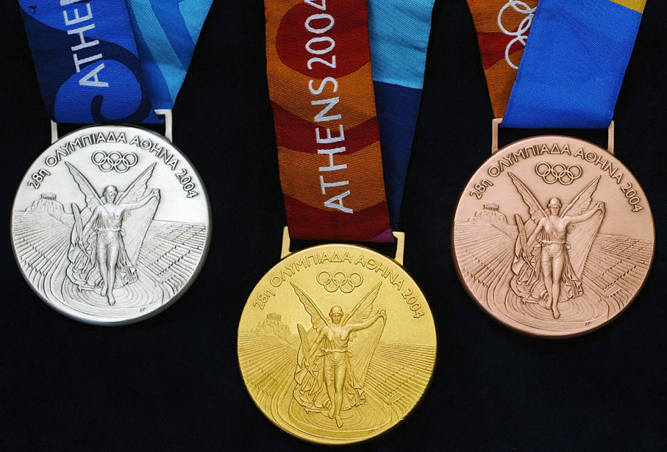 <p>A set of gold, silver and bronze medals from the Athens Olympics 2004. (Milos Bicanski/Getty images) </p>