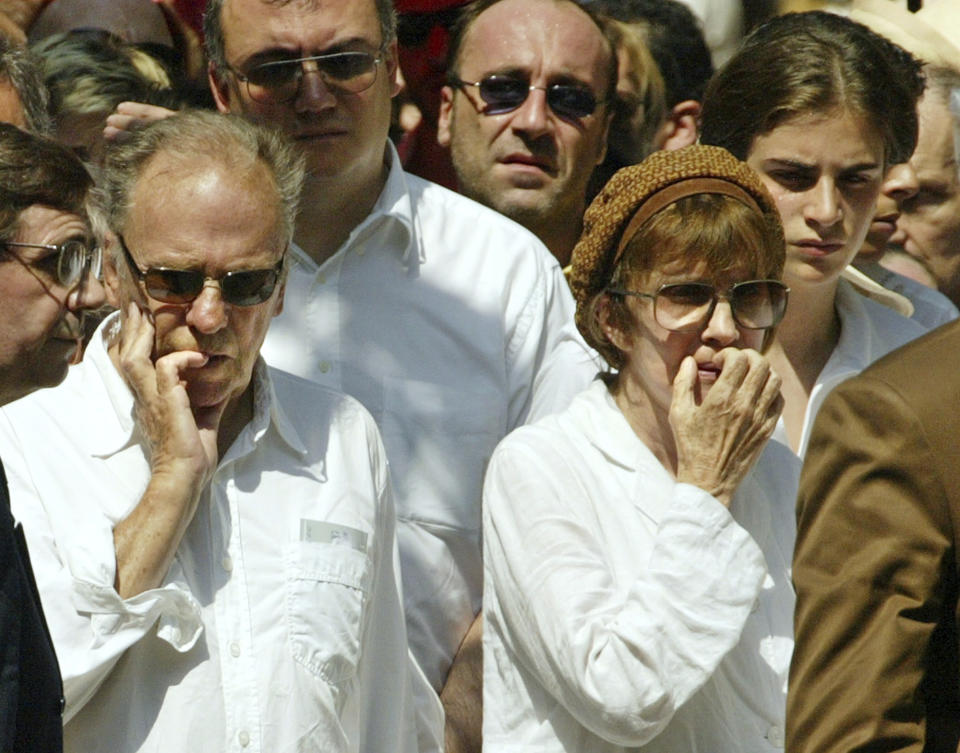FILE - French actor Jean-Louis Trintignant and his ex-wife director Nadine Trintignant arrive for the funeral of their daughter, actress Marie Trintignant, at the Pere Lachaise cemetery in Paris Wednesday, Aug. 6, 2003. French film legend and amateur racecar driver Jean-Louis Trintignant, who earned acclaim for the Oscar-winning "A Man and a Woman" a half a century ago and went on to portray the brutality of aging in his later years, has died at 91. (AP Photo/Franck Prevel, File)