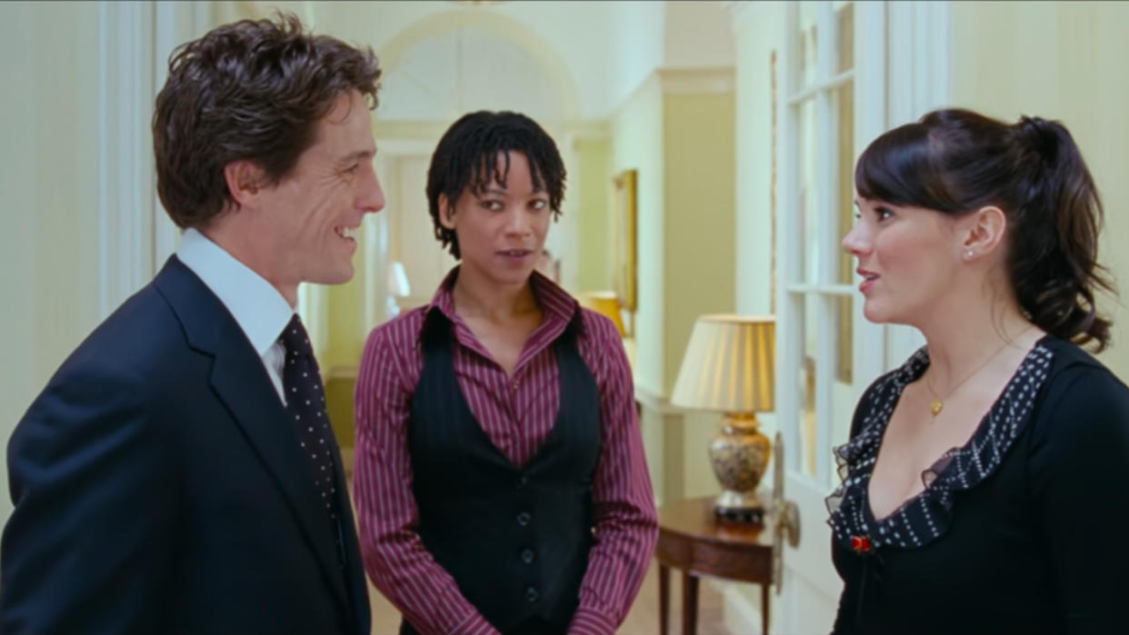  Hugh Grant, Nina Sosanya, and Marine McCutcheon in Love Actually. 