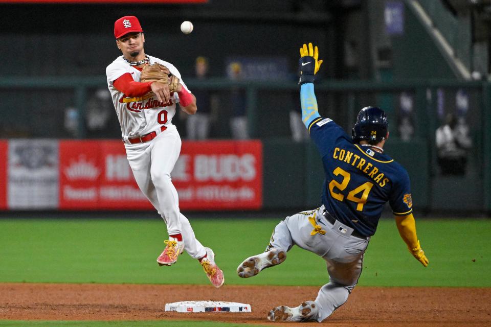 Cardinals shortstop Masyn Winn forces out Milwaukee Brewers catcher William Contreras and throws on the run to complete an inning-ending double play during the sixth inning Monday night in St. Louis.