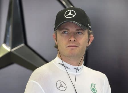 Mercedes Formula One driver Nico Rosberg looks on in the pit lane during a free practice session ahead of the weekend's Belgian F1 Grand Prix in Spa-Francorchamps, Belgium August 21, 2015. REUTERS/Yves Herman