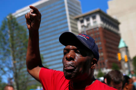 Pro-Trump supporter Kenneth Lane speaks at Public Square outside the Republican National Convention in Cleveland, Ohio, U.S. July 20, 2016. REUTERS/Shannon Stapleton