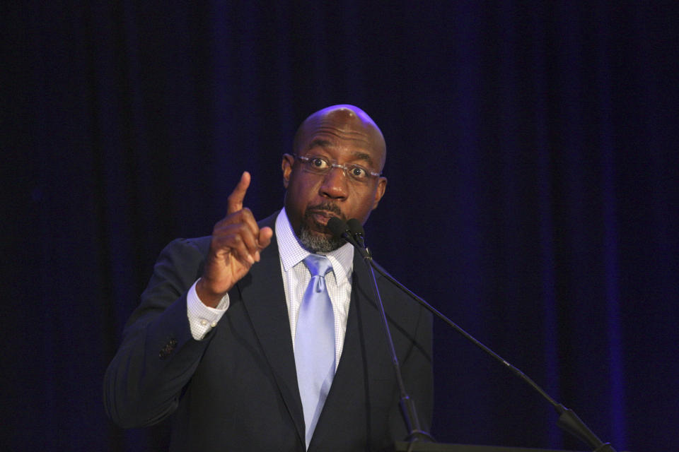 Sen. Raphael Warnock, D-Ga., addresses the Gwinnett County Democratic Party fundraiser on Saturday, May 21, 2022 in Norcross, Ga. (AP Photo/Akili-Casundria Ramsess)