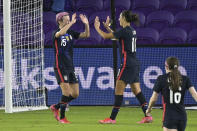 United States forward Megan Rapinoe (15) celebrates with forward Carli Lloyd (10) after Rapinoe score her second goal during the first half of a SheBelieves Cup women's soccer match against Argentina, Wednesday, Feb. 24, 2021, in Orlando, Fla. (AP Photo/Phelan M. Ebenhack)