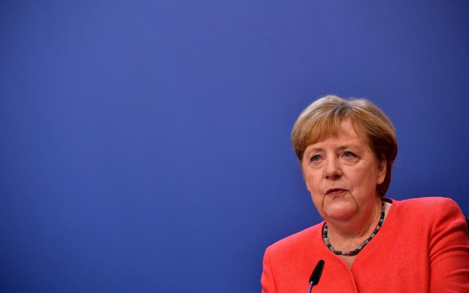 Mandatory Credit: Photo by JOHN THYS/POOL/EPA-EFE/Shutterstock (10717759x) German Chancellor Angela Merkel speaks during a joint video press conference with French President Emmanuel Macron at the end of the European Council in Brussels, Belgium, 21 July 2020. European Union nations leaders agreed on a budget and a recovery mechanism after meeting face-to-face for a fourth day to discuss plans to respond to the coronavirus pandemic and a new long-term EU budget. Special European Council in Brussels, Belgium - 21 Jul 2020 - JOHN THYS/POOL/EPA-EFE/Shutterstock