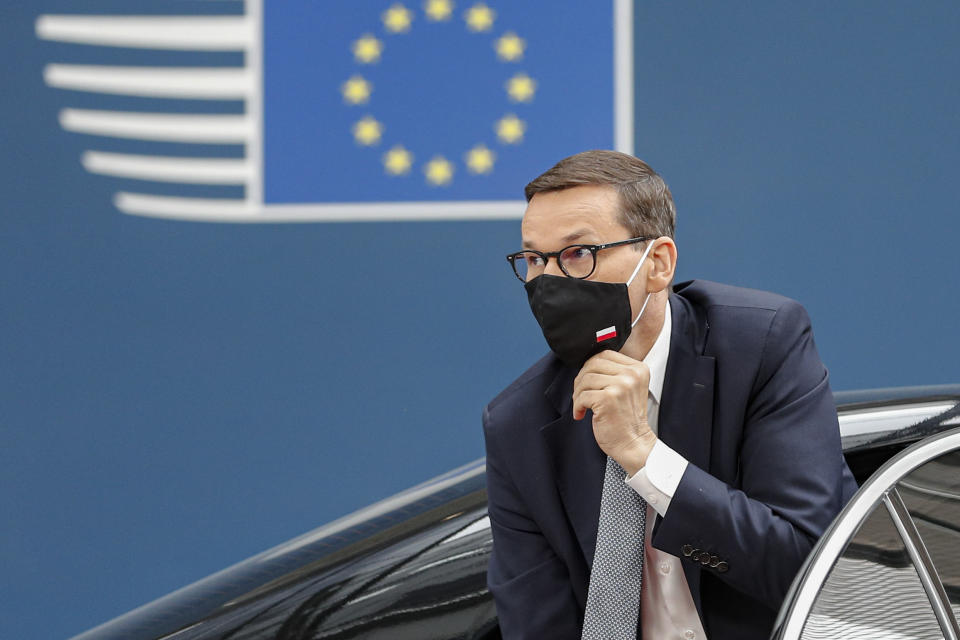 FILE - In this Thursday, June 24, 2021 file photo, Poland's Prime Minister Mateusz Morawiecki arrives for an EU summit at the European Council building in Brussels. When Hungary and Poland joined the European Union in 2004, after decades of Communist domination, they thirsted for Western democratic standards and prosperity yet, 17 years later, as the EU ramps up efforts to rein in democratic backsliding in both countries, some of the governing right-wing populists in Hungary and Poland are comparing the bloc to their former Soviet oppressors — and flirting with the prospect of exiting the bloc. (Johanna Geron/Pool Photo via AP, File)