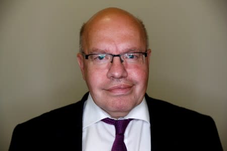 German Economy Minister Peter Altmaier poses for a portrait during an interview with Reuters in his ministry building in Berlin