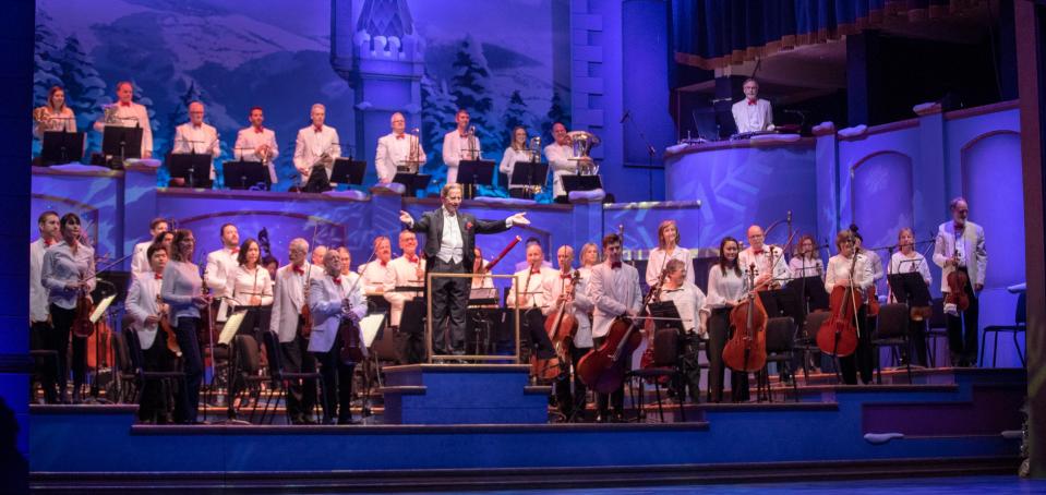 The Indianapolis Symphony Orchestra is recognized by conductor Jack Everly at Yuletide Celebration, showcasing the Indianapolis Symphony Orchestra, at Hilbert Circle Theater, Indianapolis, Sunday. Dec. 23, 2018. The extravaganza features dancing, holiday songs, and skits. 