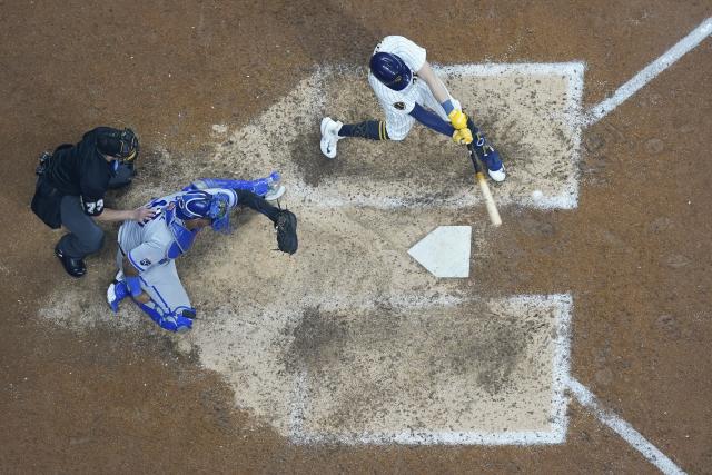 Milwaukee Brewers' Owen Miller hits a double during the ninth inning of a baseball game against the Kansas City Royals Saturday, May 13, 2023, in Milwaukee. (AP Photo/Morry Gash)
