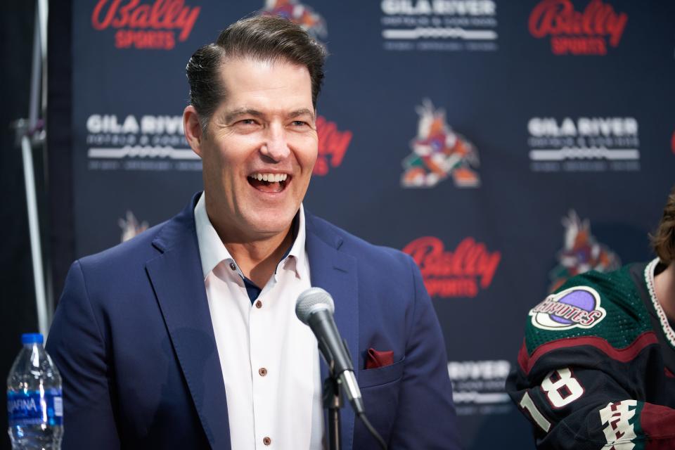 Coyotes general manager Bill Armstrong laughs after a question was asked during a news conference in July.