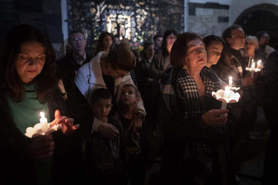 Faithful pray as they take part in a pro-life march in Zagreb, Croatia, Friday, March 15, 2024. Scores of religious and neo-conservative groups in recent years have been building up pressure in the staunchly Catholic country, trying to force a ban on abortions. (AP Photo/Darko Bandic)