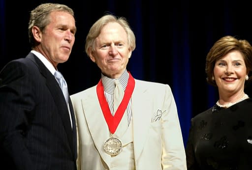 Wolfe, seen here with then president George W. Bush and first lady Laura Bush in 2002 after receiving the National Humanities Medal