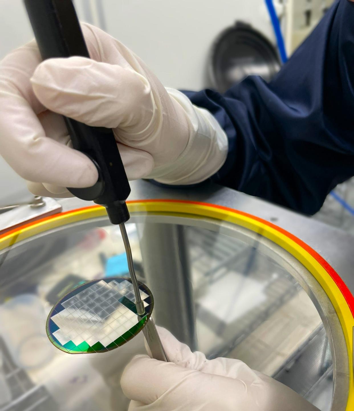 An NHanced Semiconductors employee works on a product in the company's North Carolina facility.