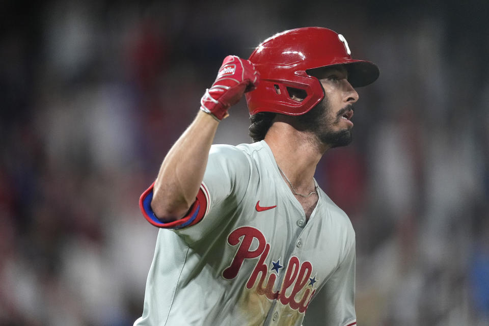 Philadelphia Phillies' Garrett Stubbs gestures after hitting an RBI single off Colorado Rockies relief pitcher Justin Lawrence during the eighth ninth inning of a baseball game Saturday, May 25, 2024, in Denver. (AP Photo/David Zalubowski)