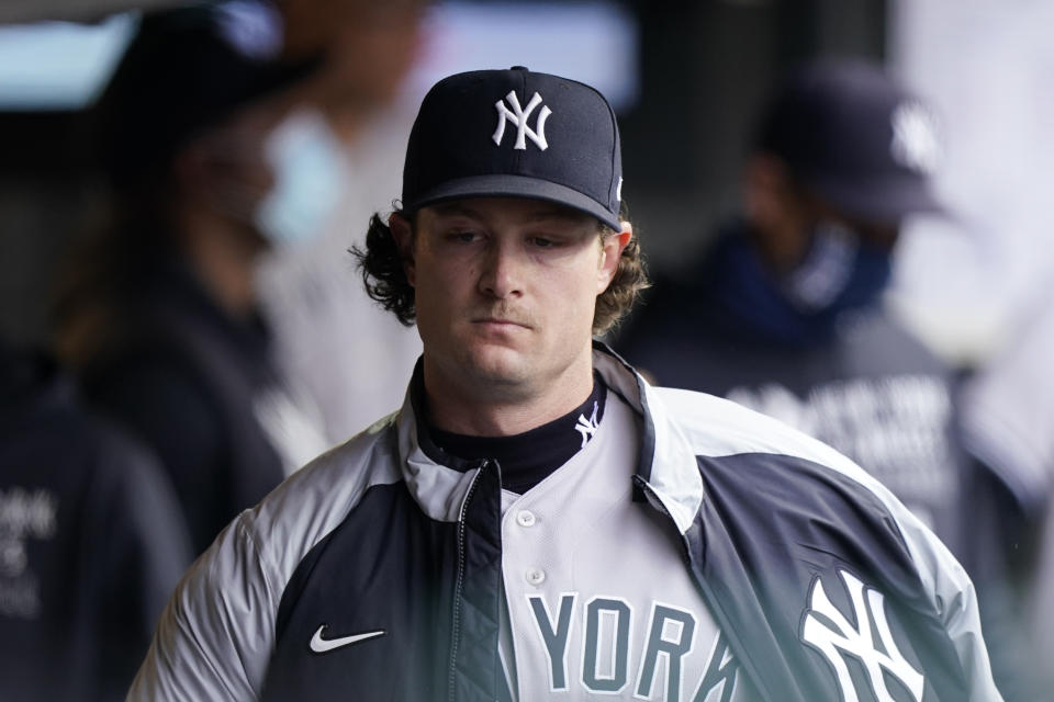 New York Yankees starting pitcher Gerrit Cole walks in the dugout after the third inning of a baseball game against the Cleveland Indians, Saturday, April 24, 2021, in Cleveland. (AP Photo/Tony Dejak)