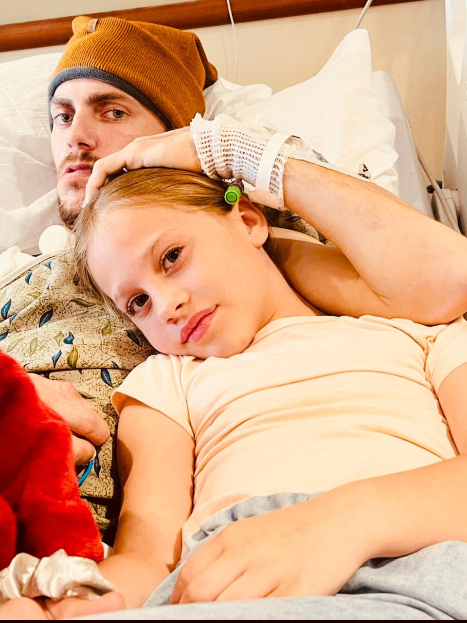 Kinsley Busard sits with her dad, Kevin, in Sparrow Specialty Long Term Acute Care on Monday, May 1.