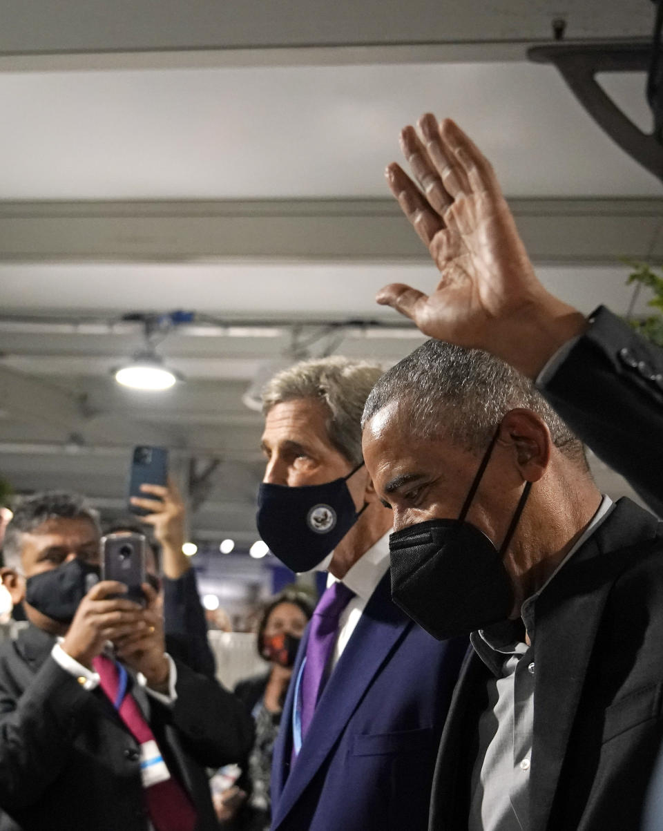 Former U.S. President Barack Obama is accompanied by John Kerry, United States Special Presidential Envoy for Climate, left, as he arrives at an event during the COP26 U.N. Climate Summit in Glasgow, Scotland, Monday, Nov. 8, 2021. The U.N. climate summit in Glasgow is entering it's second week as leaders from around the world, are gathering in Scotland's biggest city, to lay out their vision for addressing the common challenge of global warming. (AP Photo/Alberto Pezzali)