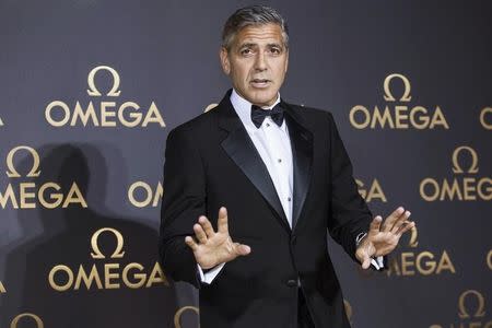 Director and actor George Clooney arrives at Omega's dinner party in Shanghai May 16, 2014. REUTERS/Aly Song/Files