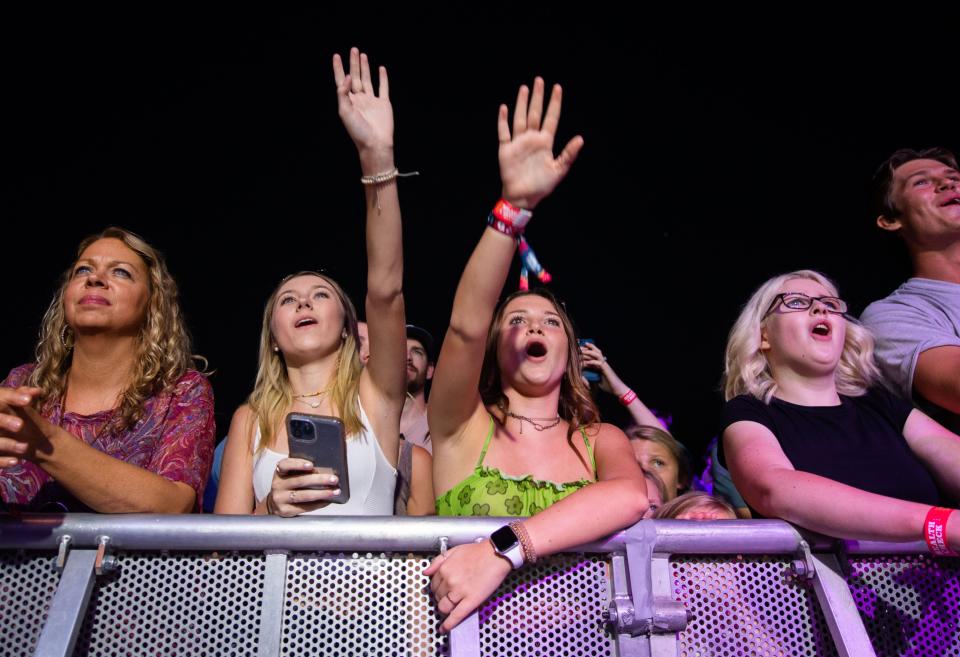 Fans wave as Maren Morris performs at the Gold Record Road during the first day of the Pilgrimage Music & Cultural Festival at the Park in Harlinsdale in Franklin, Tenn., Saturday, Sept. 25, 2021.