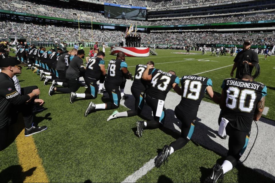 <span class="icon icon--xs icon__camera">  </span> <span class="credit font--s-m upper black"> <b>Frank Franklin II/AP</b> </span> <div class="caption space-half--right font--s-m gray--med db"> Jacksonville Jaguars players kneel before the national anthem at an NFL football game against the New York Jets, Oct. 1. </div>