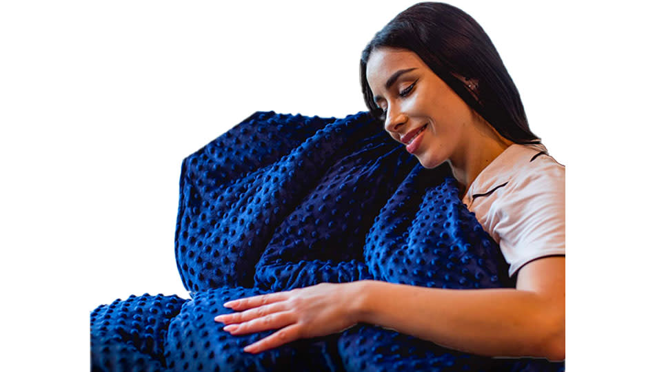 Woman hugging a blue version of the blanket.