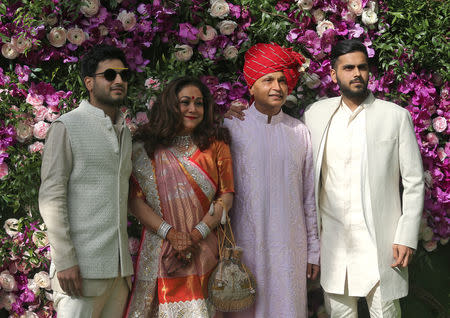 Anil Ambani (2nd R), Chairman of the Reliance Anil Dhirubhai Ambani Group, his wife Tina (2nd L) and their sons Jai Anmol and Jai Anshul pose during a photo opportunity at the wedding ceremony of Akash Ambani, son of the Chairman of Reliance Industries Mukesh Ambani, at Bandra-Kurla Complex in Mumbai, India, March 9, 2019. REUTERS/Francis Mascarenhas