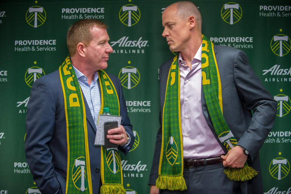PORTLAND, OR - JANUARY 08:  The Portland Timbers owner Merritt Paulson and general manager Gavin Wilkinson, chat after the press conference presentation of the club's new coach Givanni Savaresse on Monday January 8, 2018, at Providence Park, Portland, OR. (Photo by Diego Diaz/Icon Sportswire via Getty Images).