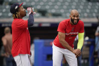 Cleveland Guardians' Amed Rosario, right, laughs as he talks with teammate Jose Ramirez, left, during a team workout Thursday, Oct. 6, 2022, in Cleveland, the day before their wild card baseball playoff game against the Tampa Bay Rays. (AP Photo/Sue Ogrocki)