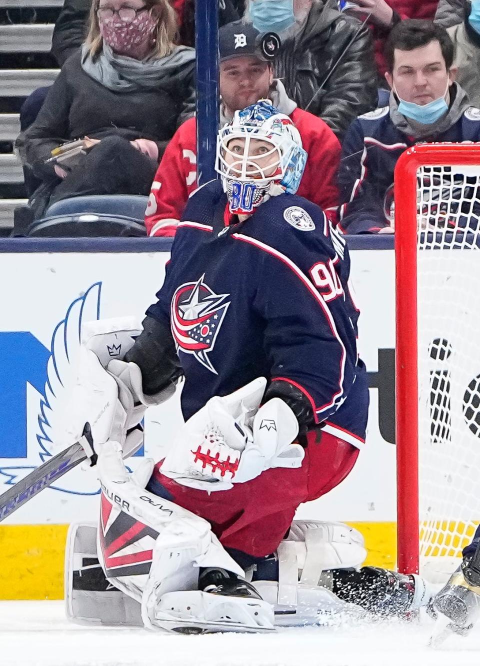 Columbus Blue Jackets goaltender Elvis Merzlikins (90) watches the puck fly over his head during the first period of the NHL hockey game against the Calgary Flames at Nationwide Arena in Columbus on Wednesday, Jan. 26, 2022. 