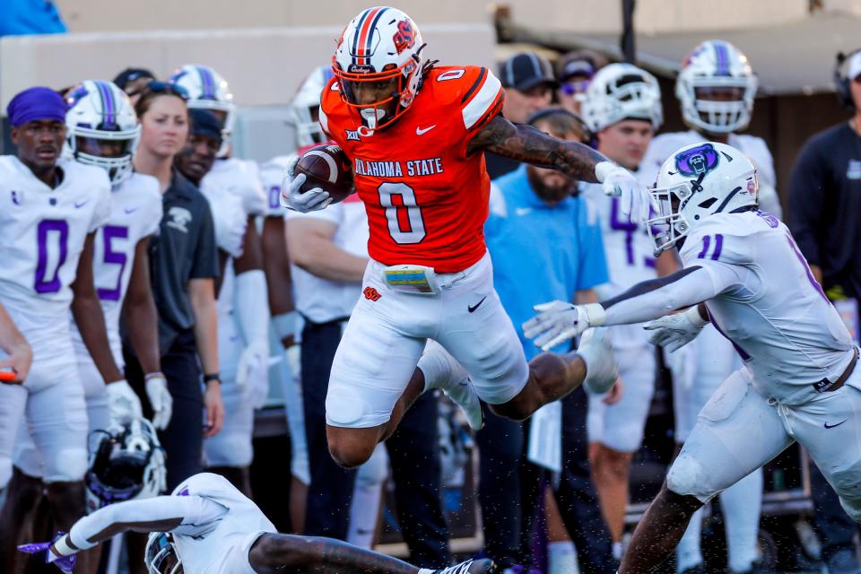 Sep 2, 2023; Stillwater, Oklahoma, USA; Oklahoma State's Ollie Gordon II (0) runs the ball in the first quarter during an NCAA football game between Oklahoma State and Central Arkansas at Boone Pickens Stadium. Mandatory Credit: Nathan J. Fish-USA TODAY Sports