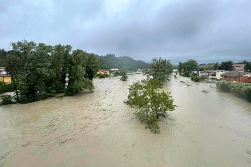 A view of an overflowing Savio river in Cesena, central Italy, Wednesday, May 17, 2023. The mayor of the city of Cesena, Enzo Lattuca, posted a video early Wednesday on Facebook to warn that continued heavy rains in the Emilia-Romagna region could again flood the Savio river and smaller tributaries. He urged residents to move to upper floors of their homes and avoid riverbanks, and announced the closure to traffic of some bridges and streets after heavy flooding sent rivers of mud sloshing through town.