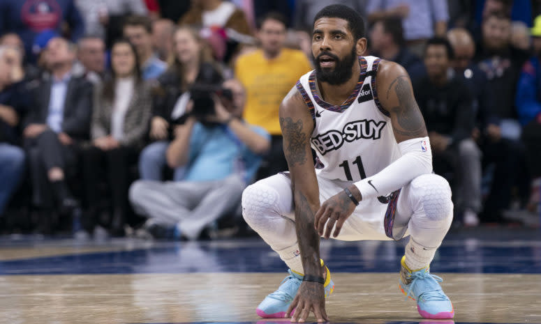 Kyrie Irving on the floor for the Brooklyn Nets during an NBA game.