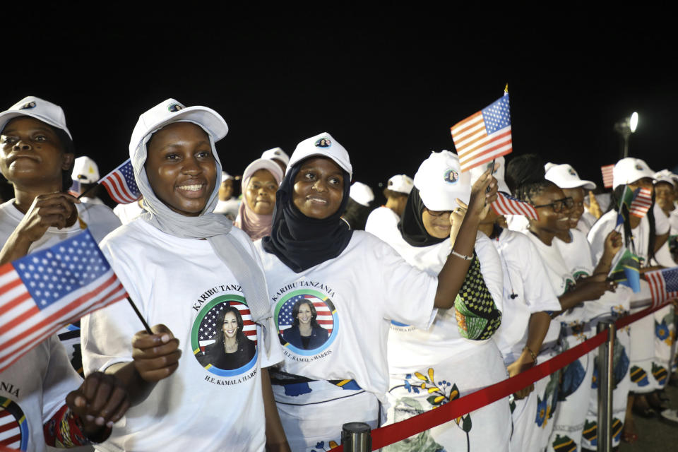 People welcome U.S. Vice President Kamala Harris on her arrival at Julius Nyerere International Airport in Dar es Salaam Wednesday, March 29, 2023. (Ericky Boniphace/Pool Photo via AP)