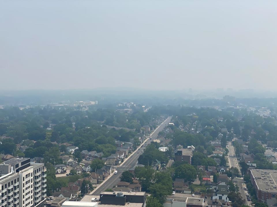 Wildfire smoke created hazy conditions in downtown Kitchener, Ont., on June 7, 2023. Environment Canada issued a special air quality statement for the region due to high levels of air pollution that day. (CBC - image credit)